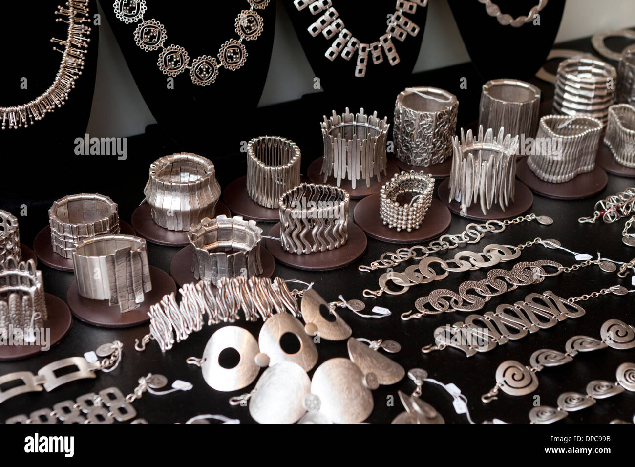 Womens stainless steel cuff bracelets on display Stock Photo Alamy