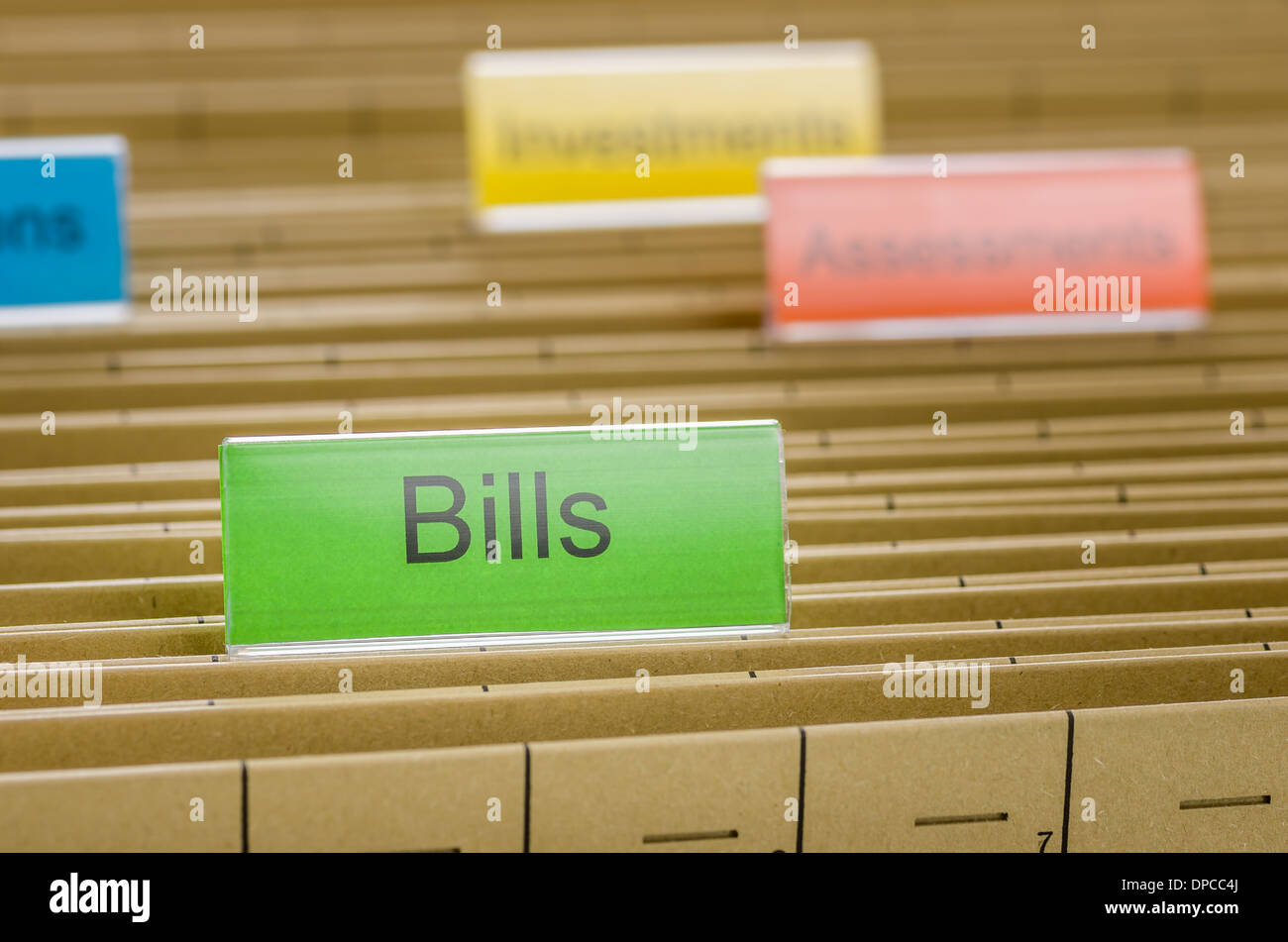 Hanging file folder labeled with Bills Stock Photo Alamy