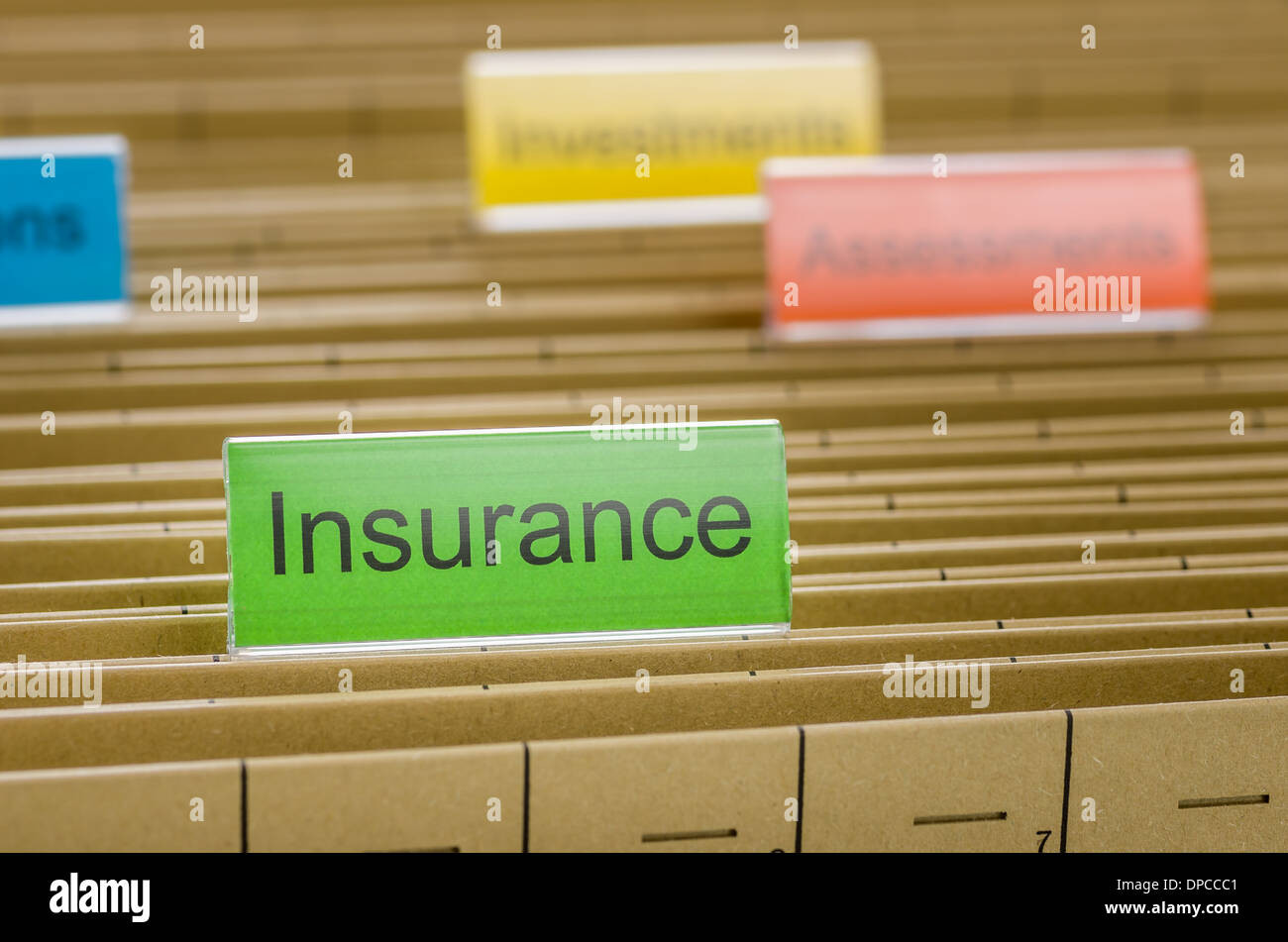 Hanging file folder labeled with Insurance Stock Photo - Alamy