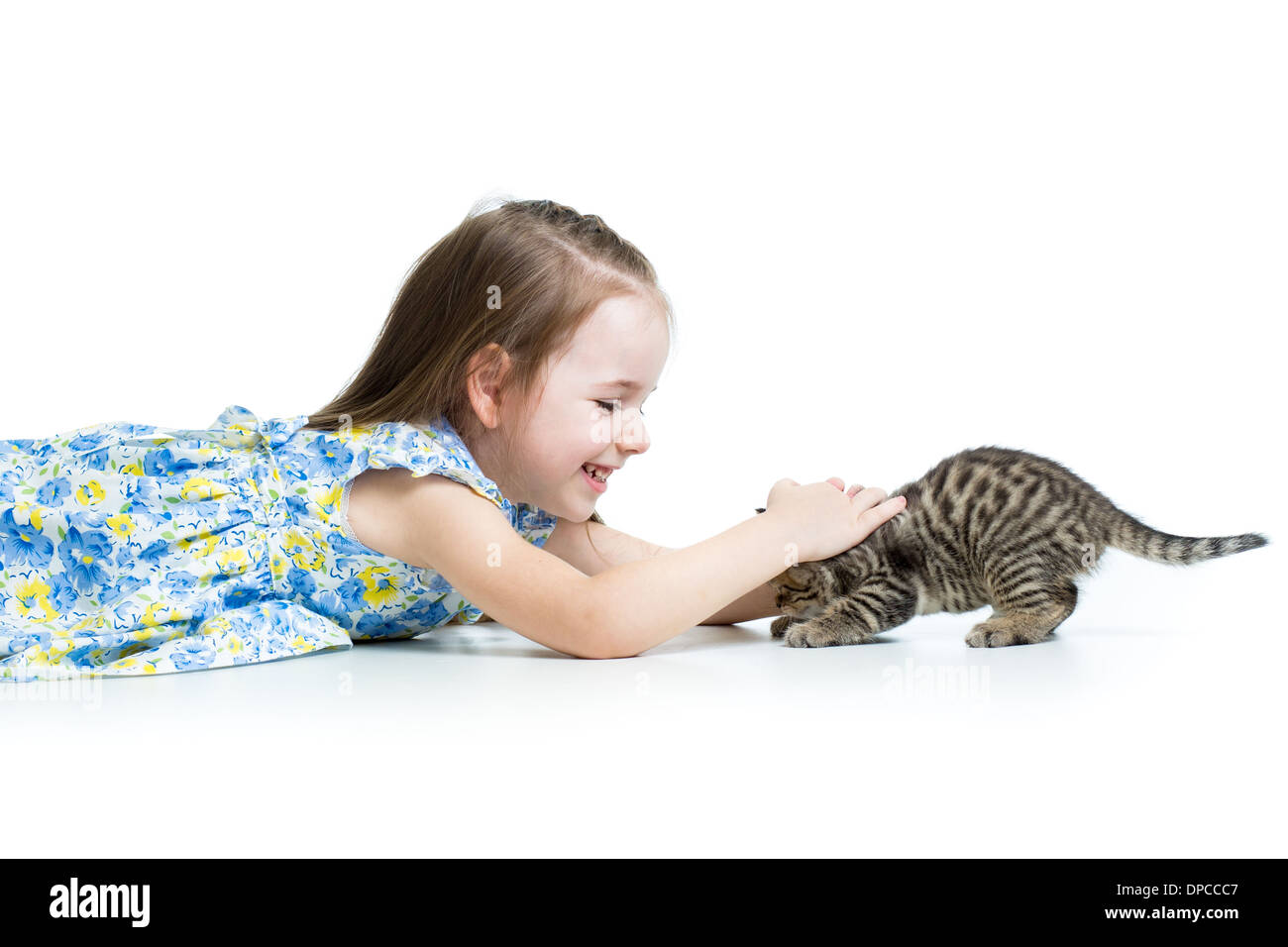 Funny kid girl playing with cat kitten Stock Photo - Alamy