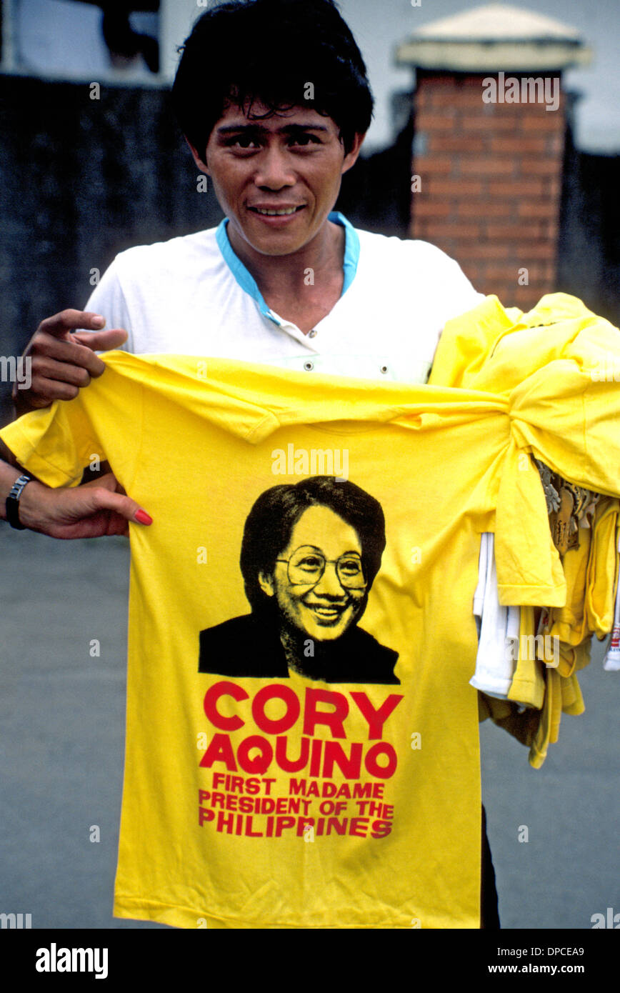 A street vendor in Manila in 1987 hawks T-shirts honoring Corazon 'Cory' Aquino, the first female president of the Philippines from 1986 to 1992. Stock Photo