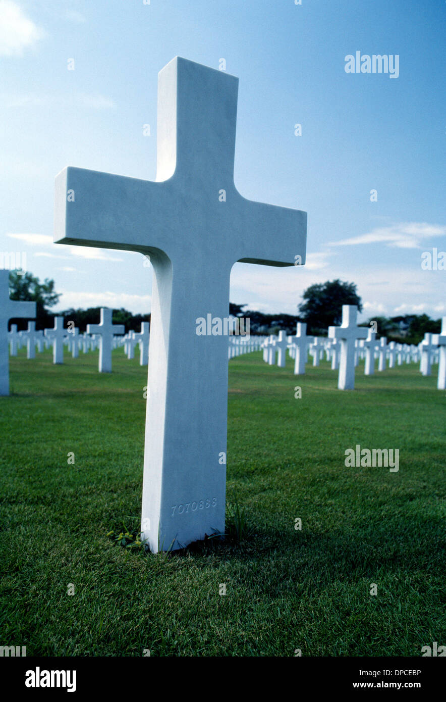 This white marble cross at the Manila American Cemetery and Memorial in the Philippines marks one of 17,097 World War II burial sites for US Forces. Stock Photo