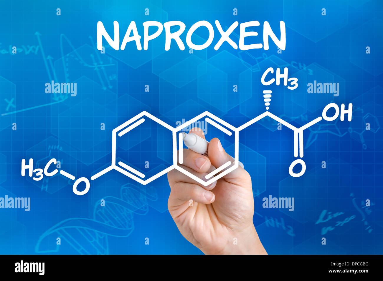 Hand with pen drawing the chemical formula of naproxen Stock Photo Alamy
