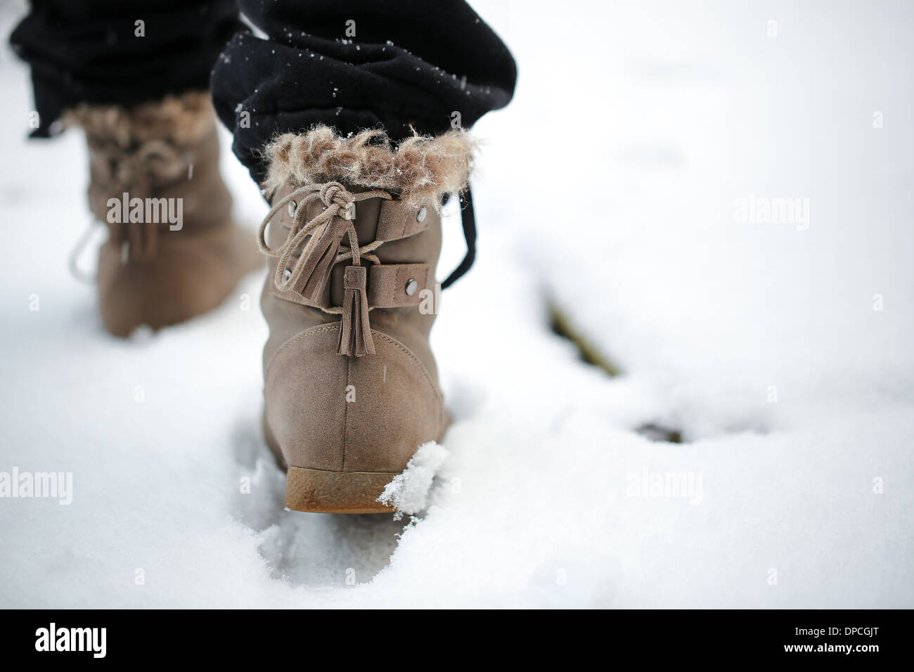 Woman in black boots walking hi-res stock photography and images - Alamy