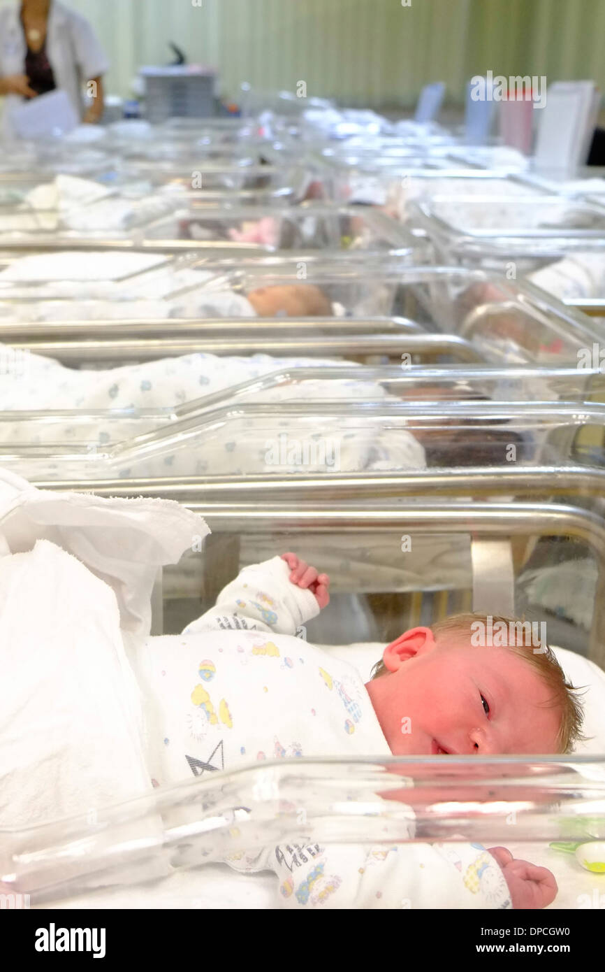 Newborn infant baby in a maternity ward Stock Photo