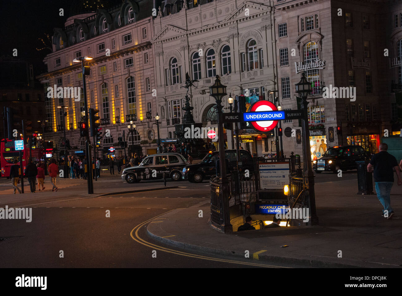 London Piccadilly circus at night with red buses and london cabs ...