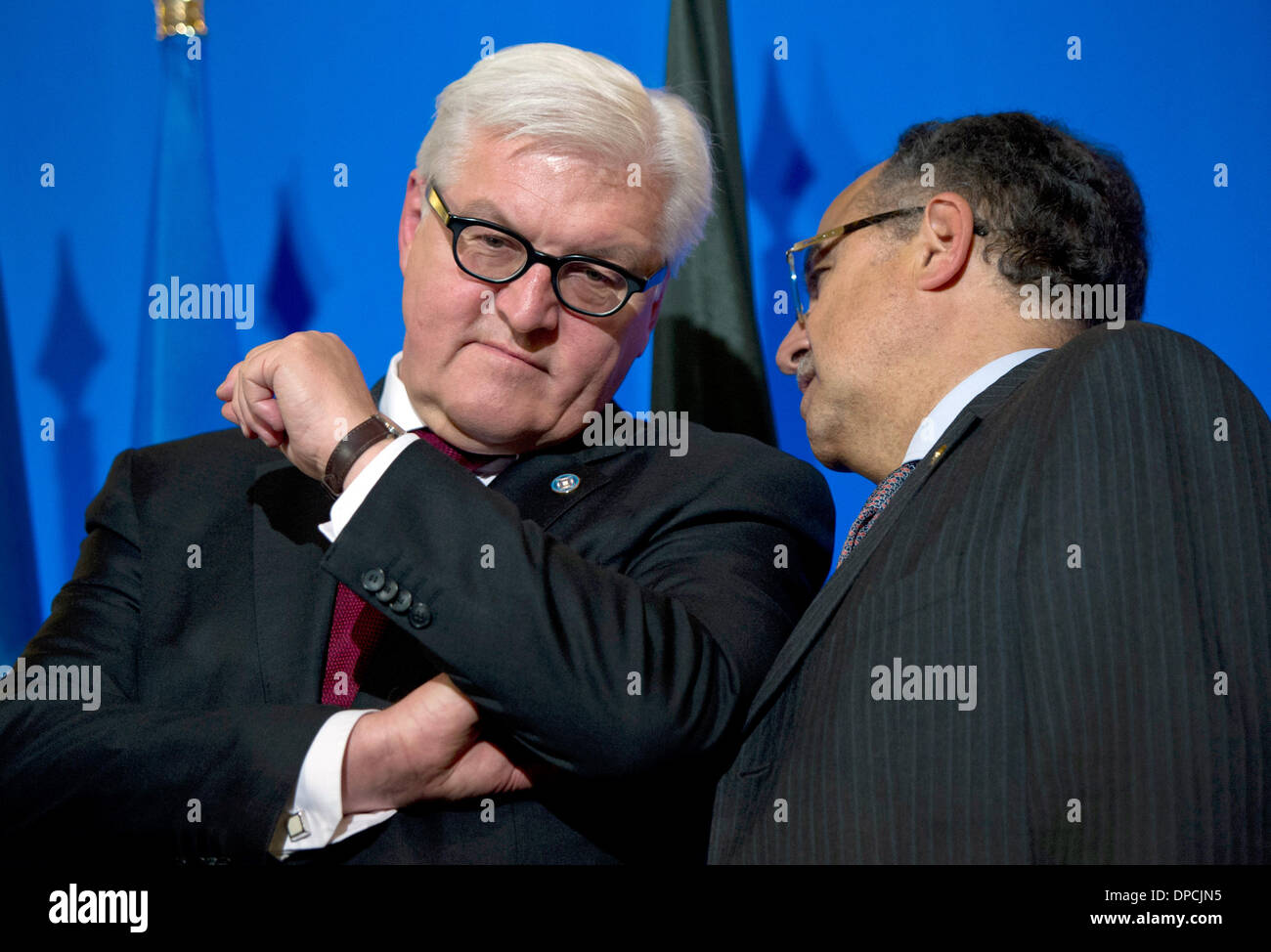 Paris, France. 12th Jan, 2014. German Foreign Minister Frank-Walter Steinmeier (L) speaks with Egyptian Foreign Minister Nabil Fahmy during the ministerial meeting of the core group of the 'Friends of the Syrian people' in Paris, France, 12 January 2014. Steinmeier visits Paris in order to take part in meetings on Syria, before flying to Israel for diplomatic talks and to attend the funeral ceremony for late former Israeli prime minister Ariel Sharon, who died on 11 January. Photo: DANIEL NAUPOLD/dpa/Alamy Live News Stock Photo