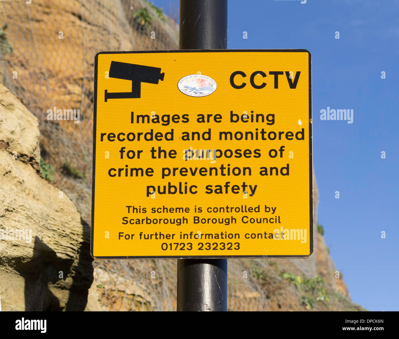 Statutory notice warning of the presence of CCTV surveillance cameras and giving a contact telephone number to check usage Stock Photo