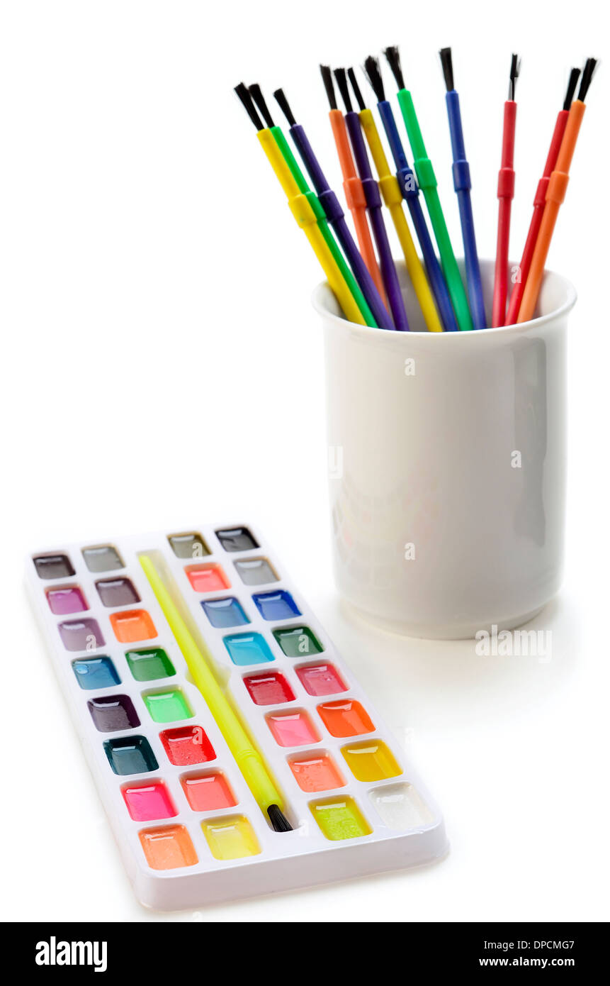 Watercolor paints and brushes for school on white background Stock Photo