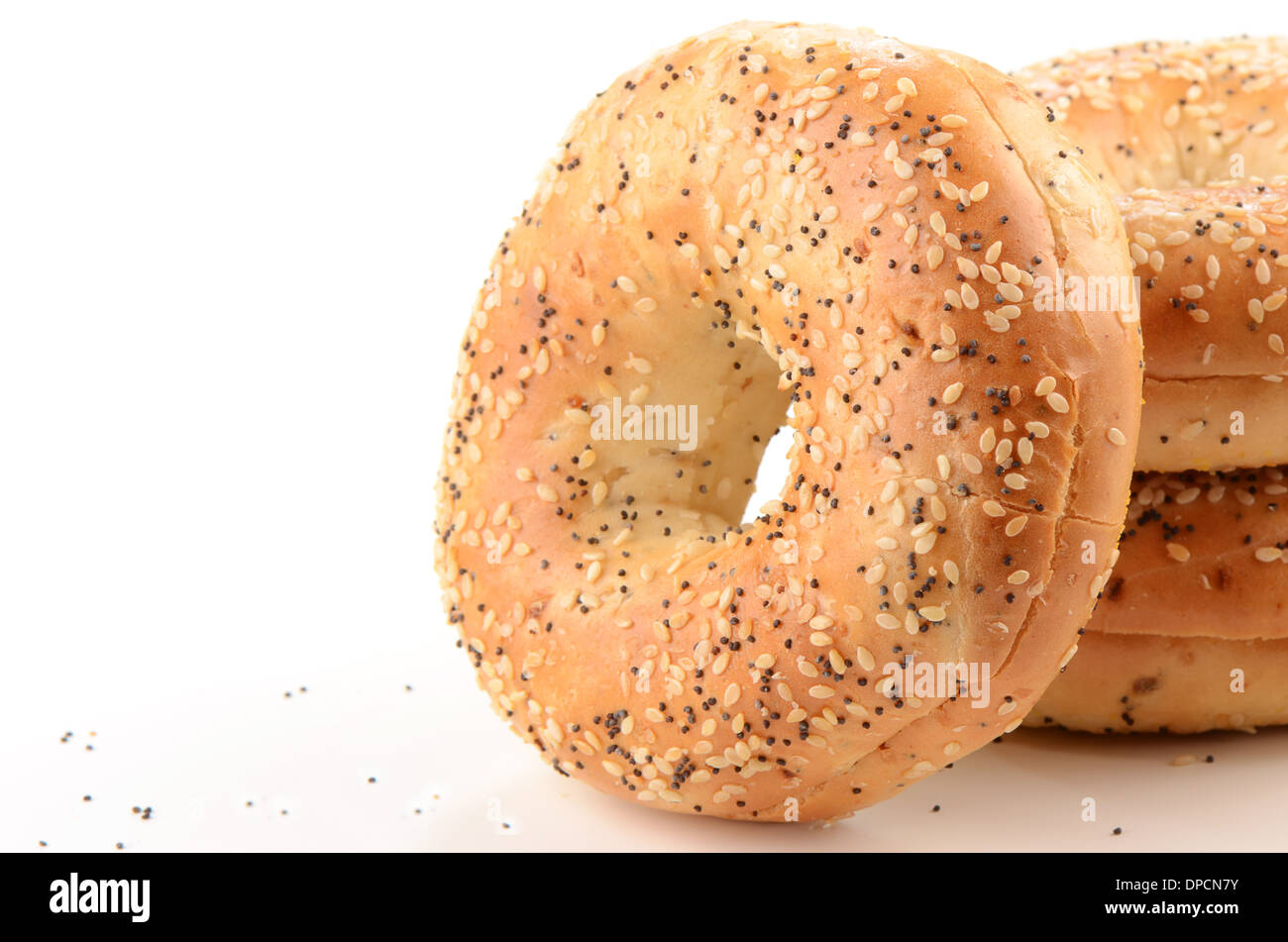 Poppy Seed And Sesame Seed Bagels On White Background With Room
