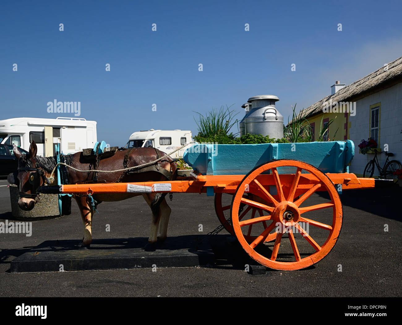 fake artificial model donkey cart milk pail ardmore village waterford ireland summer tidy neat town Stock Photo