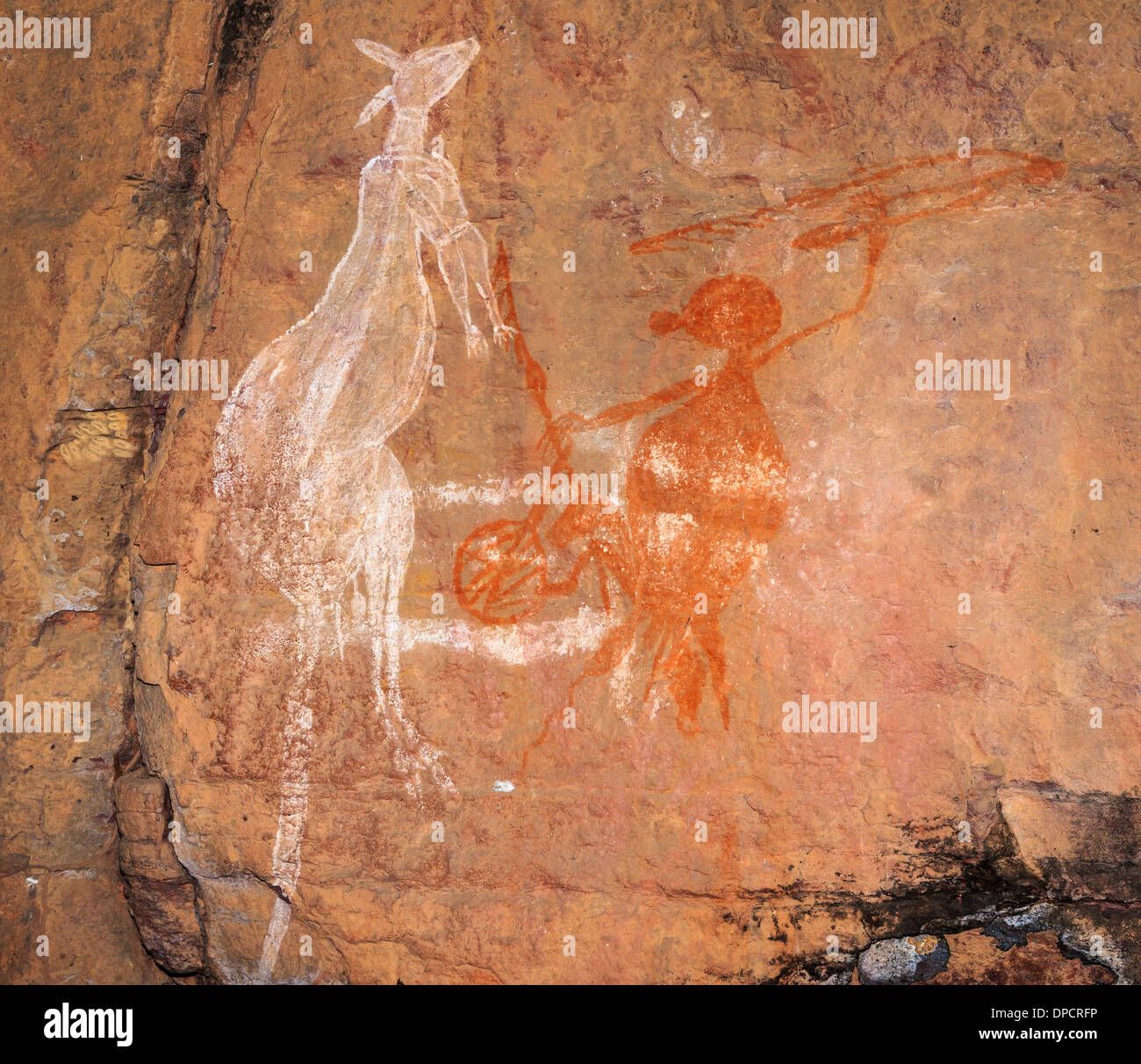 Old rock art of the Aborigines, hunting Kangaroos with a spear, Kakadu National Park, Northern Territory, Australia Stock Photo