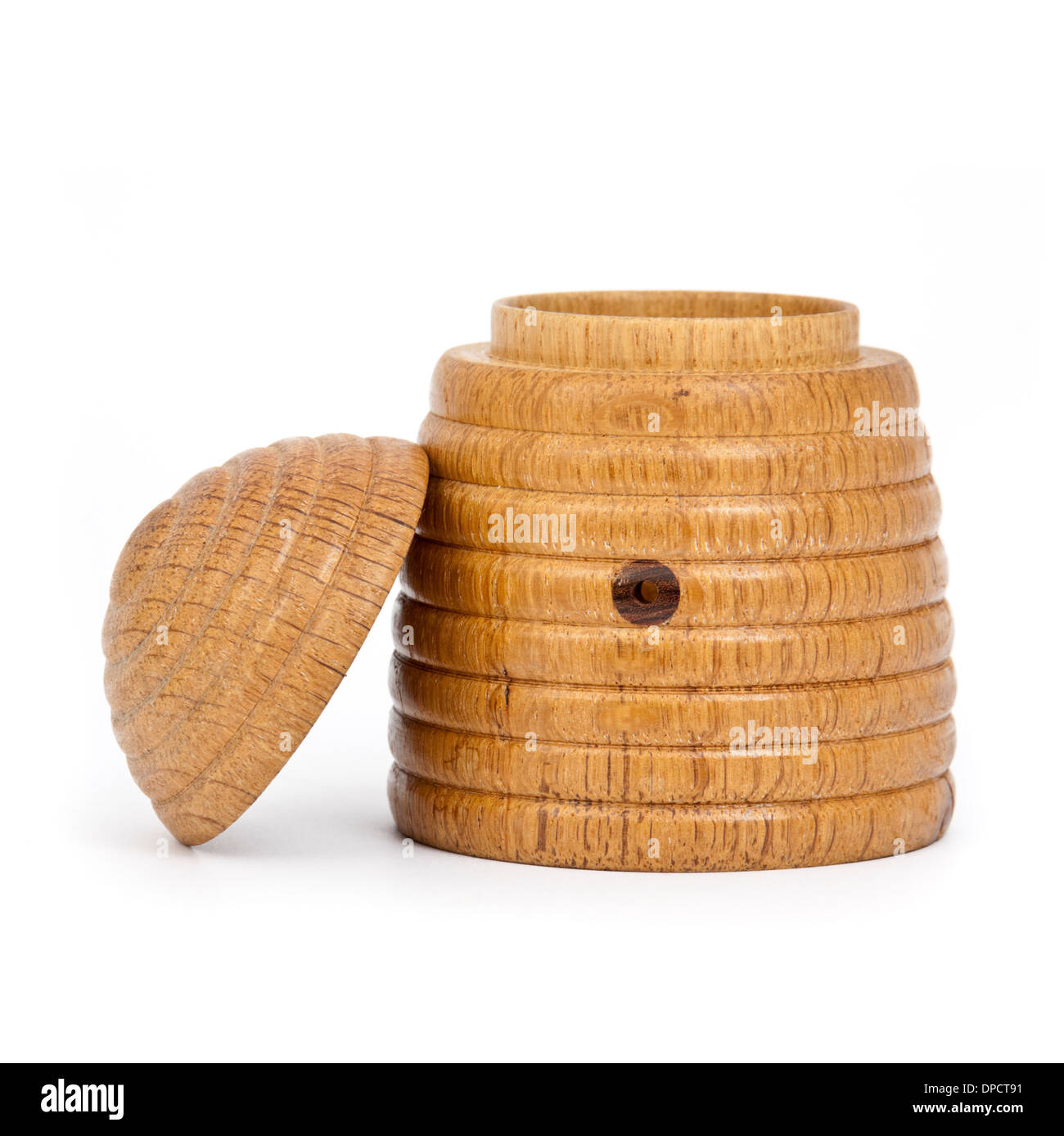 Vintage wooden beehive-shaped honey pot Stock Photo