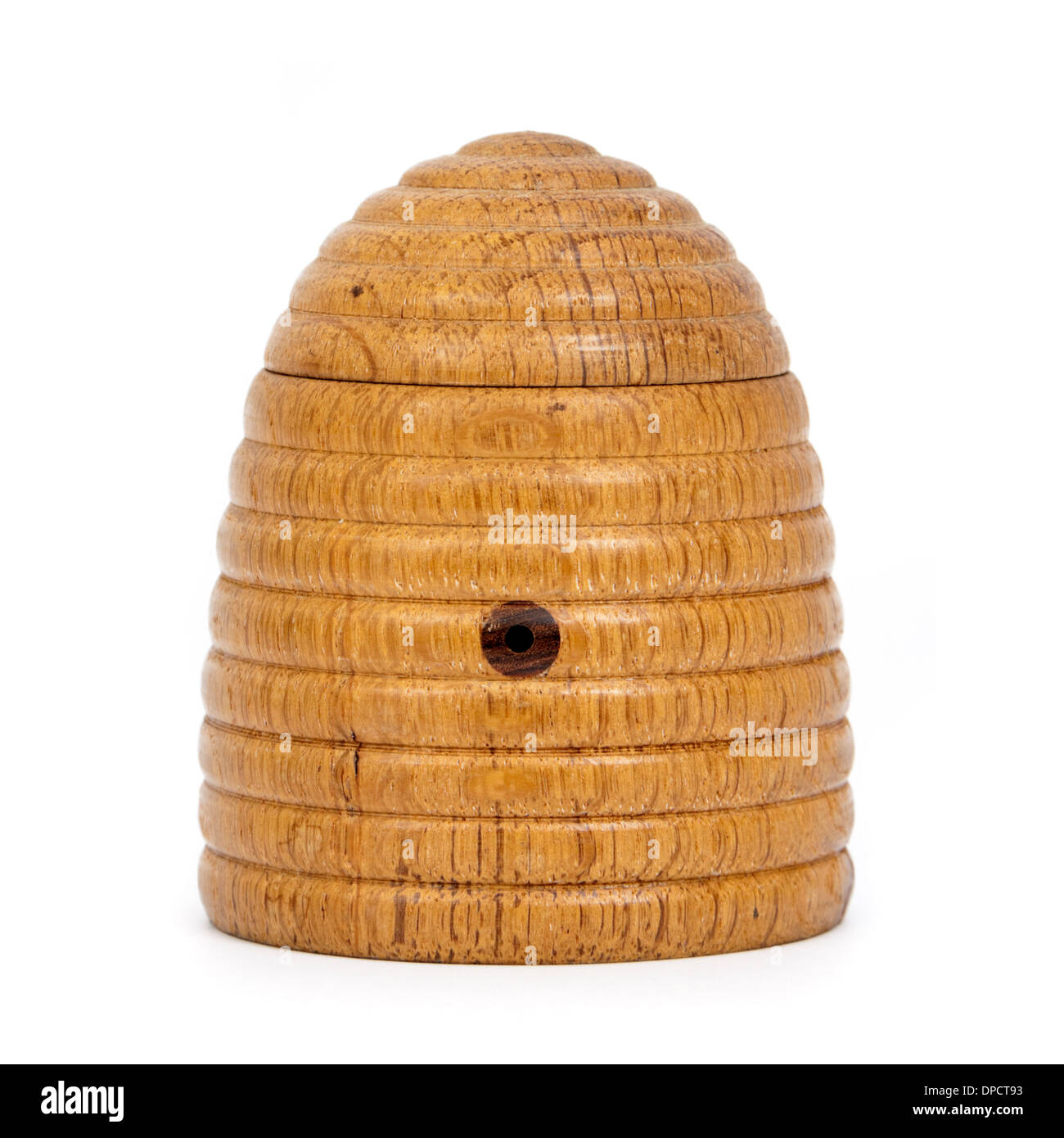 Vintage wooden beehive-shaped honey pot Stock Photo