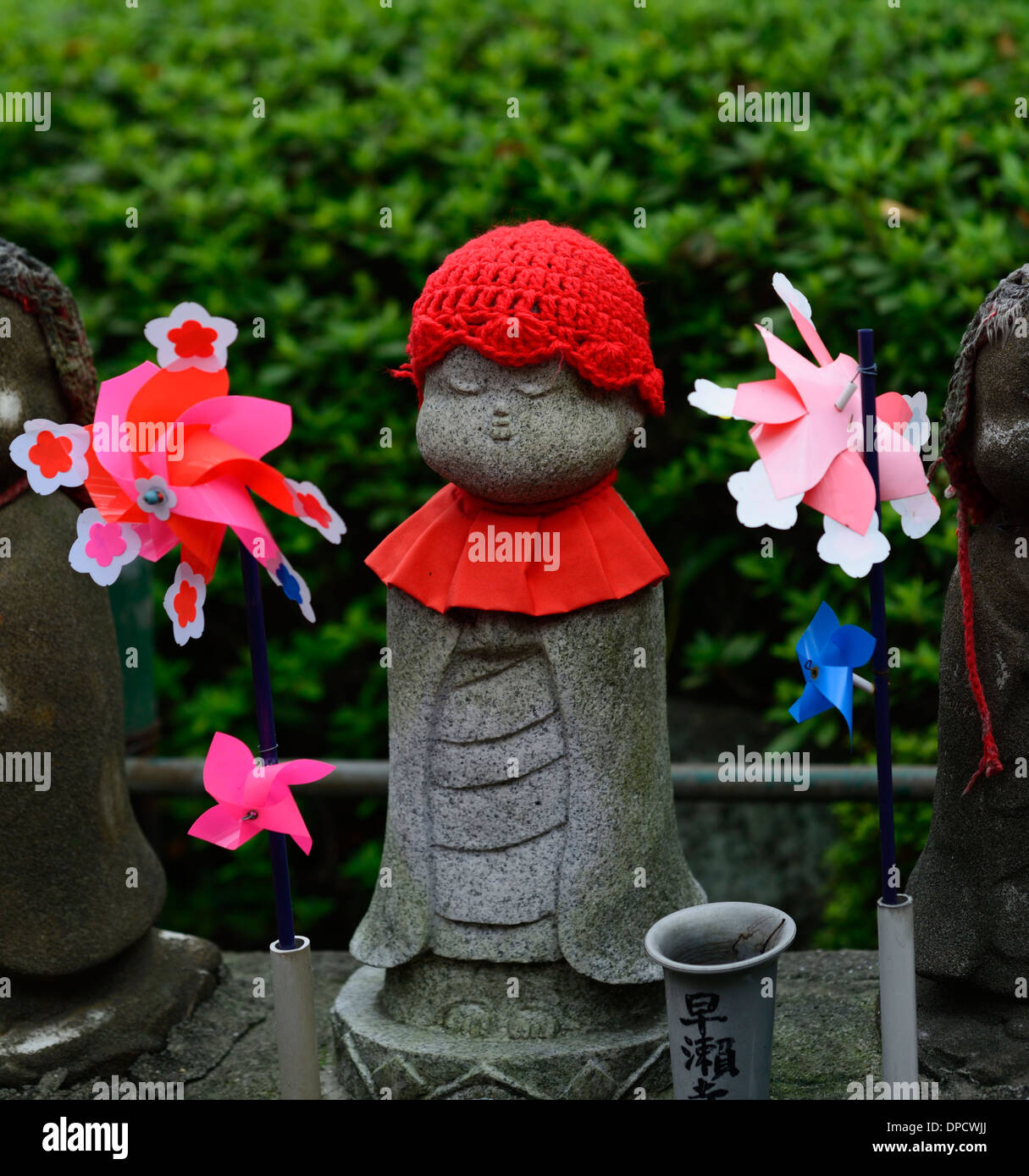 jizo statue statues zozoji Bodhisattva grief grieving memorial commemorate remember respect clothed clothes red bibs bib hat Stock Photo