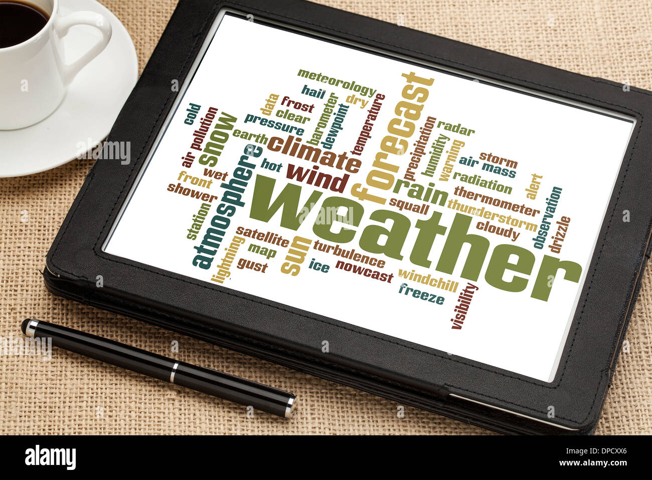 weather forecast word cloud on a digital tablet with cup of coffee Stock Photo