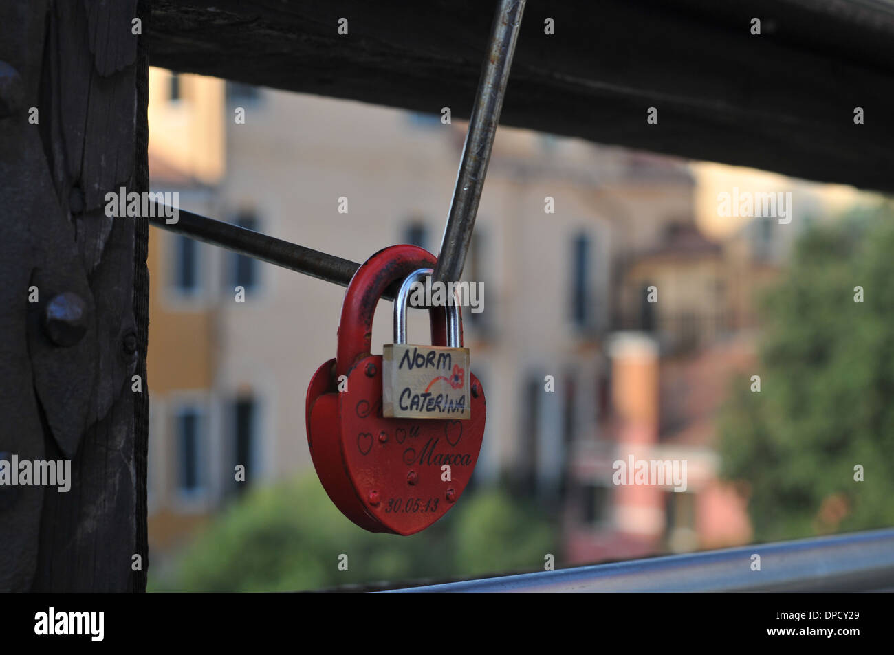 Love locks attached to a bridge railing on the Ponte dell'Accademia