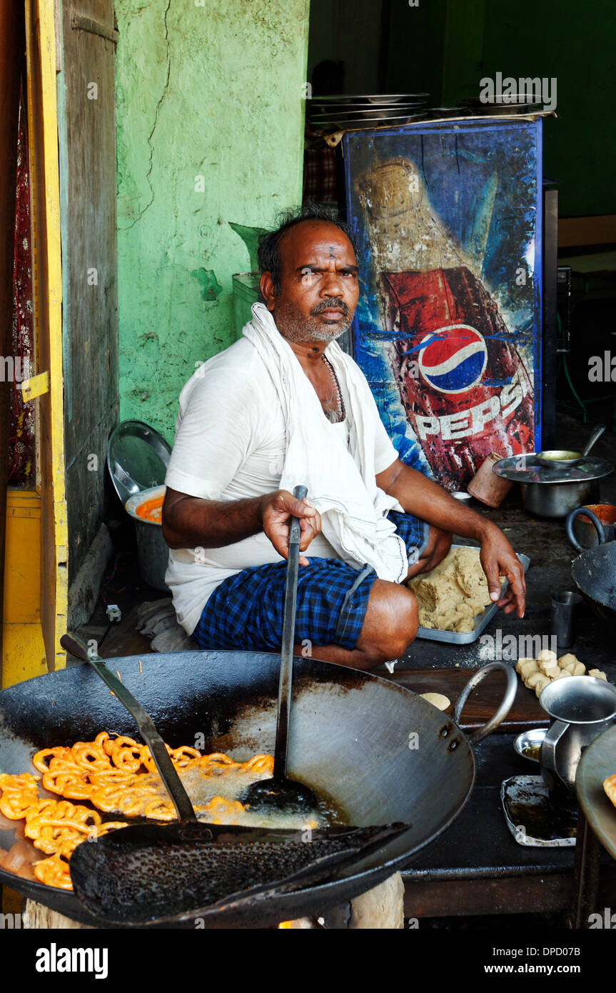 An Indian man cooking street food Stock Photo - Alamy