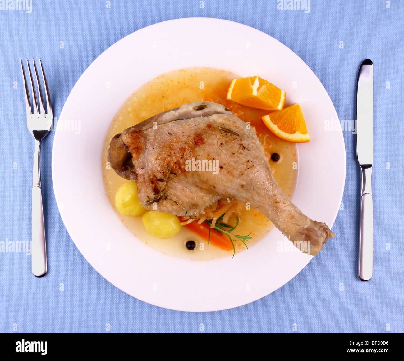Duck leg with braised cabbage, potato and gravy, top view Stock Photo