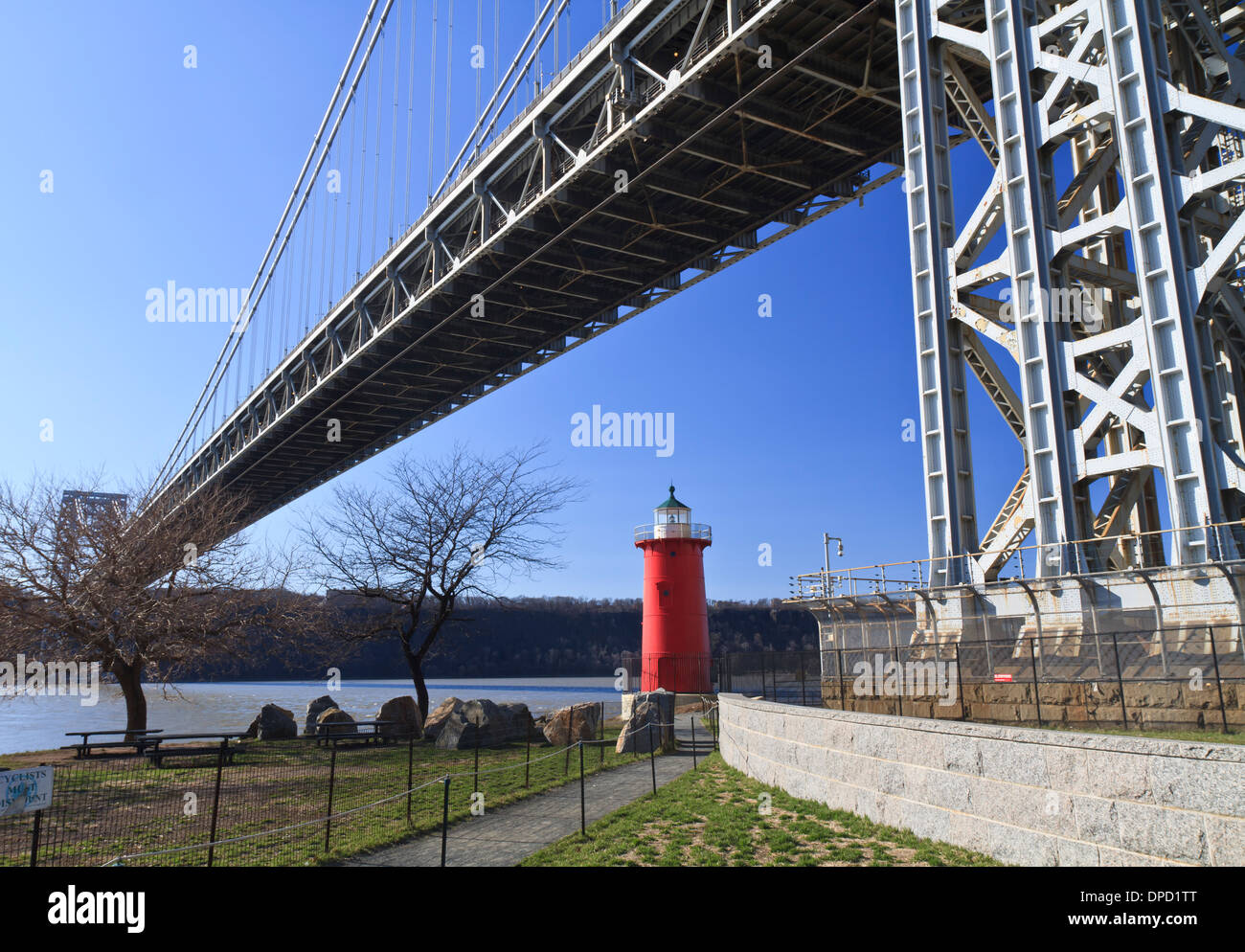 The 'Little Red Lighthouse' underneath the George Washington Bridge on the Hudson River in upper Manhattan in New York, NY Stock Photo
