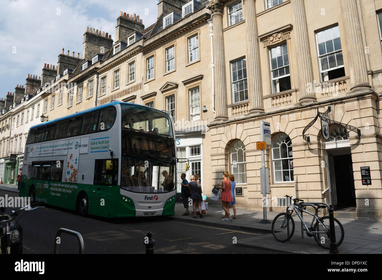 People boarding a bus in Bath City Centre England. Urban public transport Stock Photo