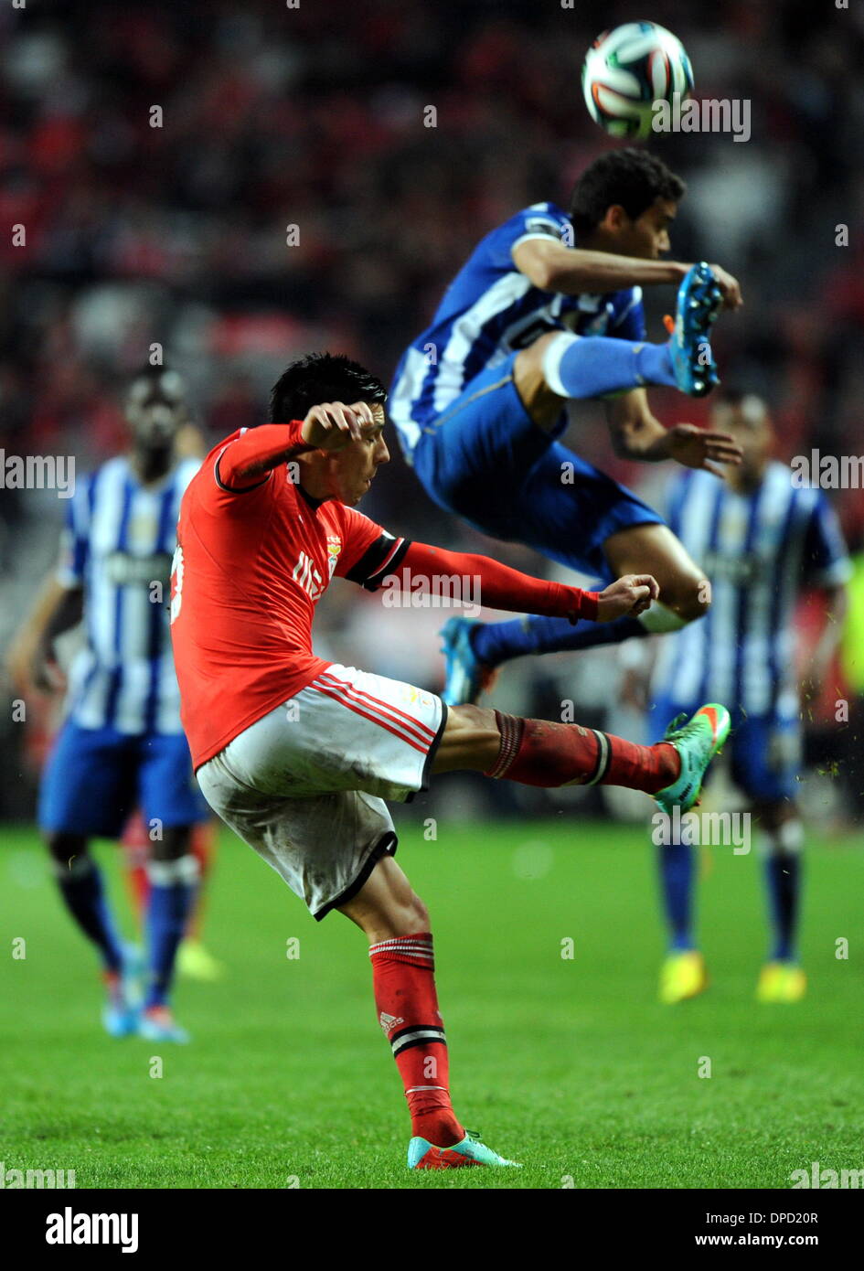 Lisbon, Portugal. 12th Jan, 2014. Benfica's Enzo Perez(L) vies for the ball during the Portuguese league football match against FC Porto at the Estadio Da Luz in Lisbon, Portugal, on Jan. 12, 2014. Benfica won 2-0. Credit:  Zhang Liyun/Xinhua/Alamy Live News Stock Photo