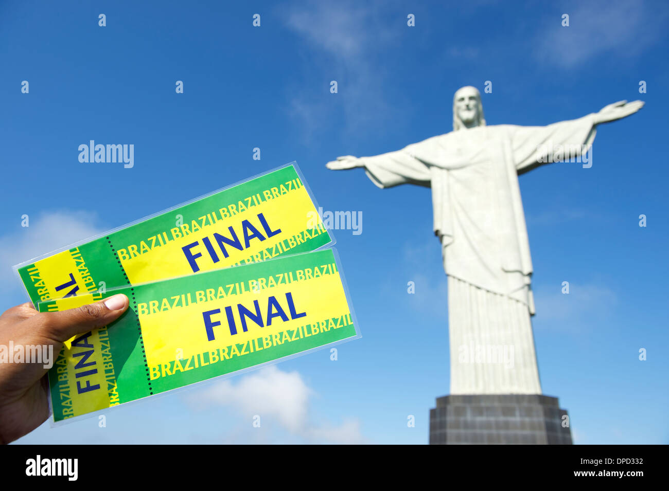 Brazilian hand holding pair of tickets at Corcovado in Rio de Janeiro Brazil Stock Photo