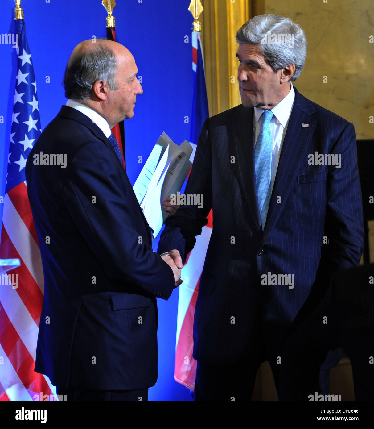 Paris, France. 12th Jan, 2014. French Foreign Affairs Minister Laurent Fabius (1st L) shakes hands with U.S. Secretary of State John Kerry after a news conference held at the French foreign ministry during a 'Friends of Syria' meeting ahead of Geneva II peace talks, in Paris, Jan. 12, 2014. Credit:  Chen Xiaowei/Xinhua/Alamy Live News Stock Photo
