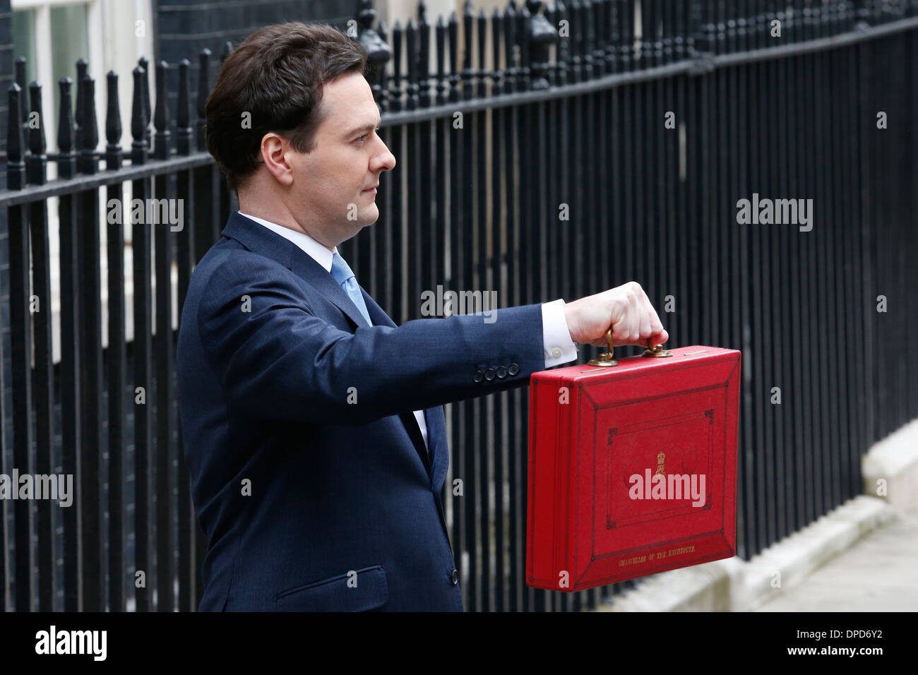 Britain's Chancellor of the Excheguer (Minister of Finance) George Osborne holds aloft his red despatch box as he leaves his off Stock Photo