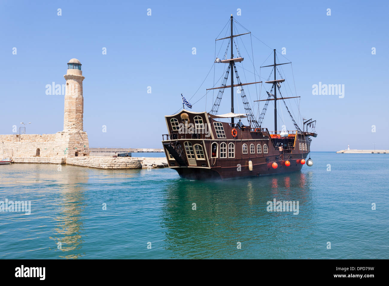 Touristic attraction Pirate galleon leaves the Venetian quay of Rethymno, Crete Island, Greece Stock Photo