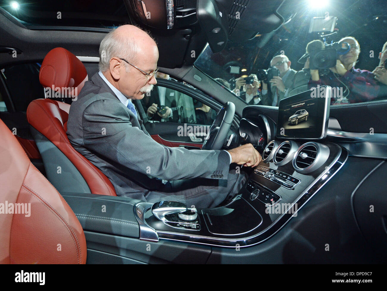 Detroit, Michigan, USA. 12th Jan, 2014. German Dieter Zetsche, Chairman of the Board of Mercedes Benz, sits inside the new Mercedes Benz C-Class car during a media event a day before the North American International Auto Show (NAIAS) start, at the Cobo Center in Detroit, Michigan, USA, 12 January 2014. The North American International Auto Show is one of the largest car shows held each year in the USA and will open to press and dealers on 13 January 2014 and to the public on 18 January 2014 until 26 January 2014. Photo: ULI DECK/dpa/Alamy Live News Stock Photo