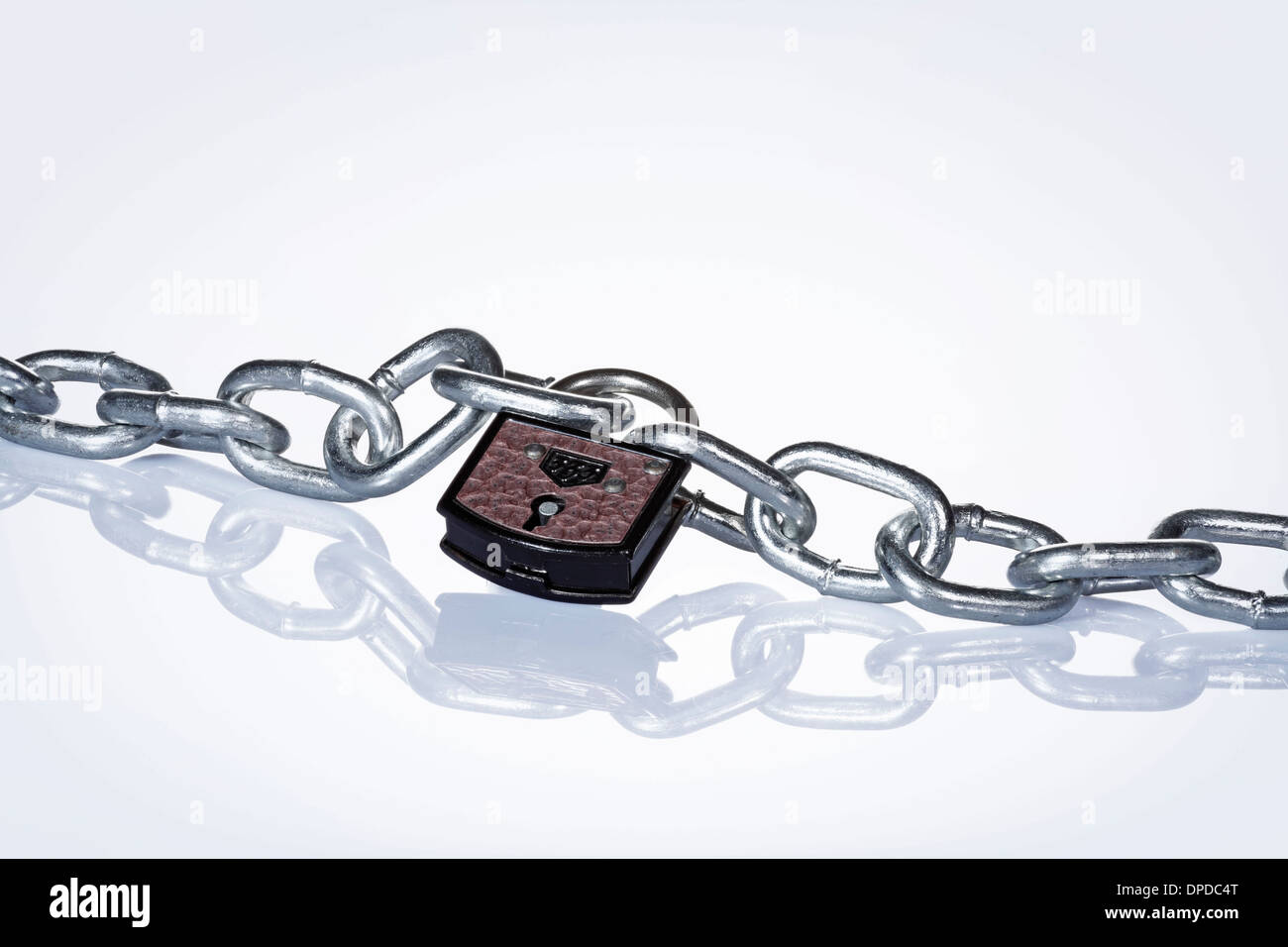 Chain with padlock against white background Stock Photo