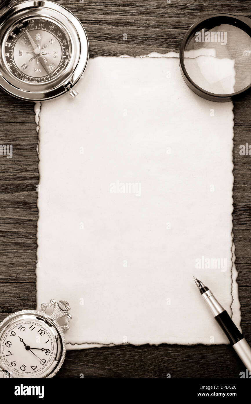 ink pen and compass on parchment background texture Stock Photo