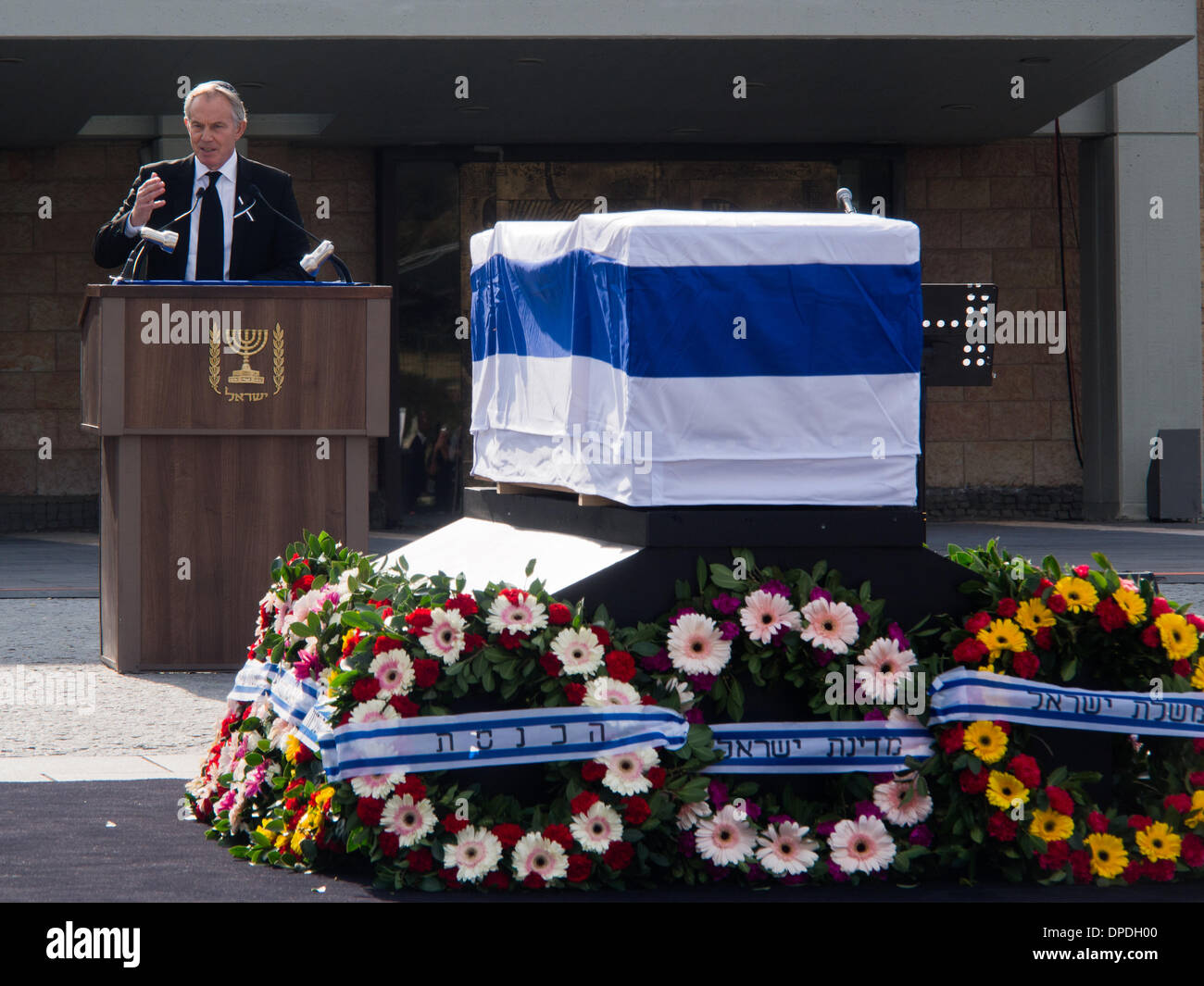 Former British PM, Tony Blair, delivers a eulogy for former Israeli Prime Minister, Ariel Sharon, at a state memorial ceremony in the Knesset plaza. Over twenty international delegations attended the ceremony, paying last respects to Sharon. Jerusalem, Israel. 13-Jan-2014.  A state memorial ceremony was held at the Knesset for Former PM Ariel Sharon. President Peres, PM Netanyahu, Knesset Speaker Edelstein, US Vice President Biden and former British PM Blair delivered eulogies. Sharon passed away Saturday at age 85. Stock Photo
