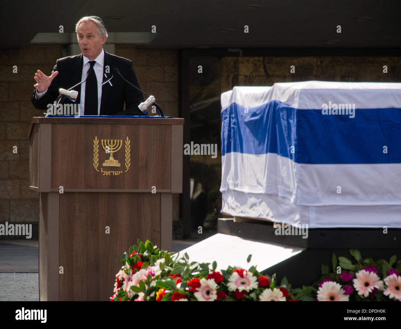 Former British PM, Tony Blair, delivers a eulogy for former Israeli Prime Minister, Ariel Sharon, at a state memorial ceremony in the Knesset plaza. Over twenty international delegations attended the ceremony, paying last respects to Sharon. Jerusalem, Israel. 13-Jan-2014.  A state memorial ceremony was held at the Knesset for Former PM Ariel Sharon. President Peres, PM Netanyahu, Knesset Speaker Edelstein, US Vice President Biden and former British PM Blair delivered eulogies. Sharon passed away Saturday at age 85. Stock Photo