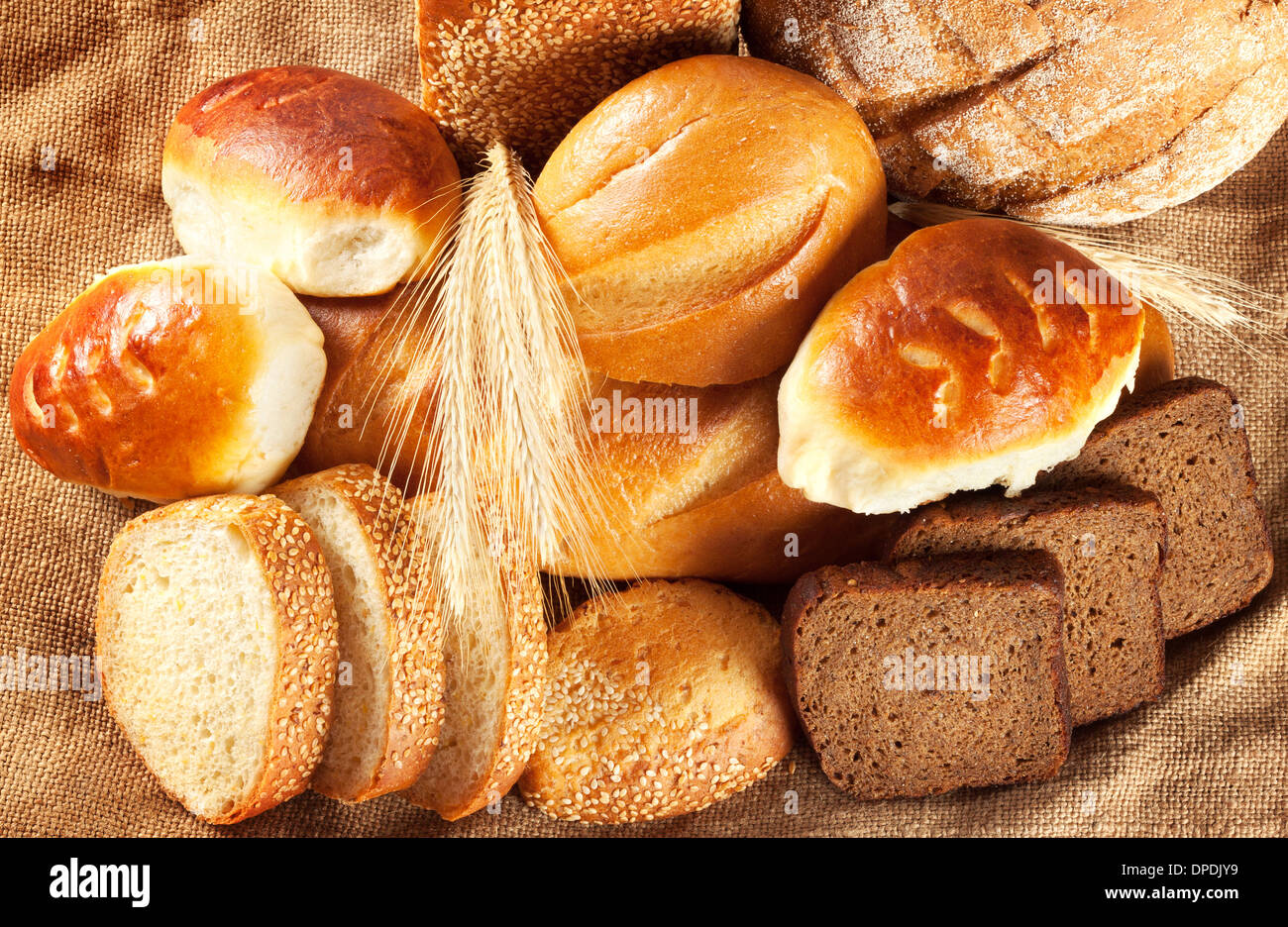A variety of fresh fragrant pastries against a coarse burlap Stock Photo