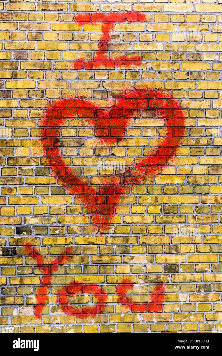 i love you heart graffiti on a yellow brick wall Stock Photo Alamy