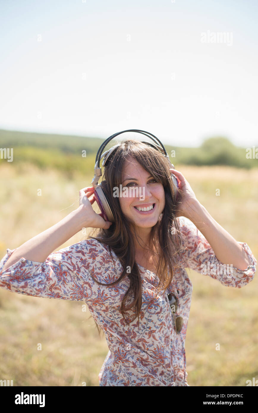 Portrait of mid adult woman wearing headphones Stock Photo