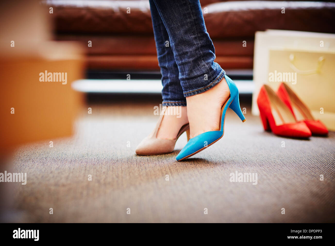 Girl trying on high heeled hi-res stock photography and images - Alamy