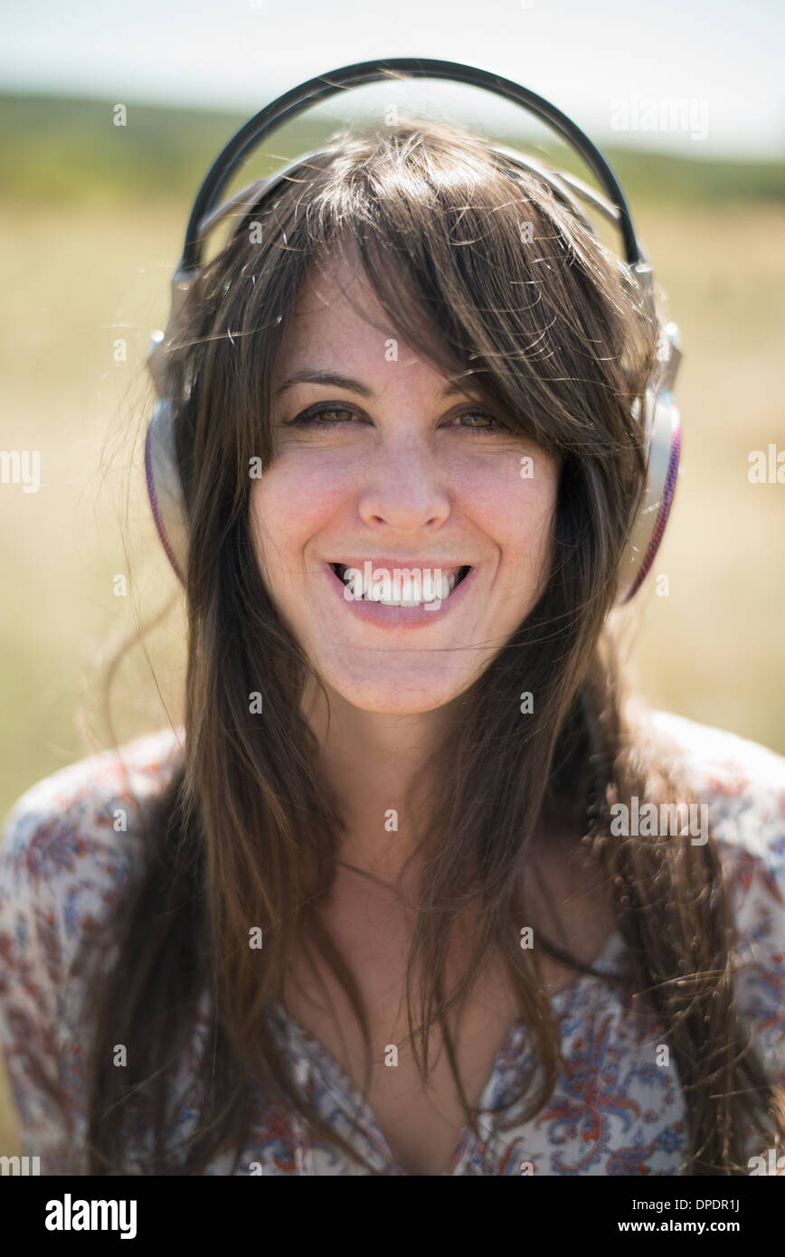 Portrait of mid adult woman wearing headphones Stock Photo