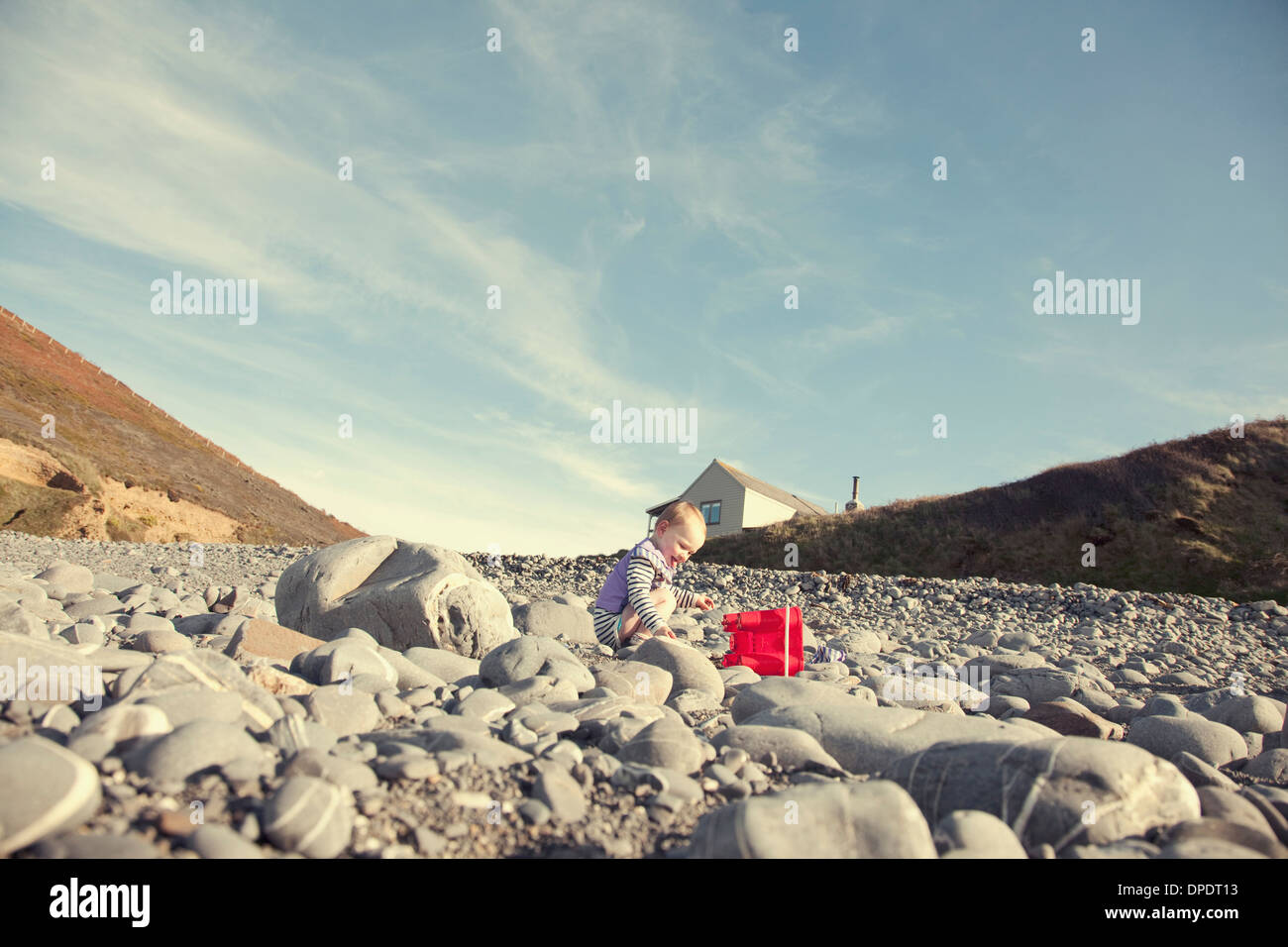 Baby girl playing on beach Stock Photo