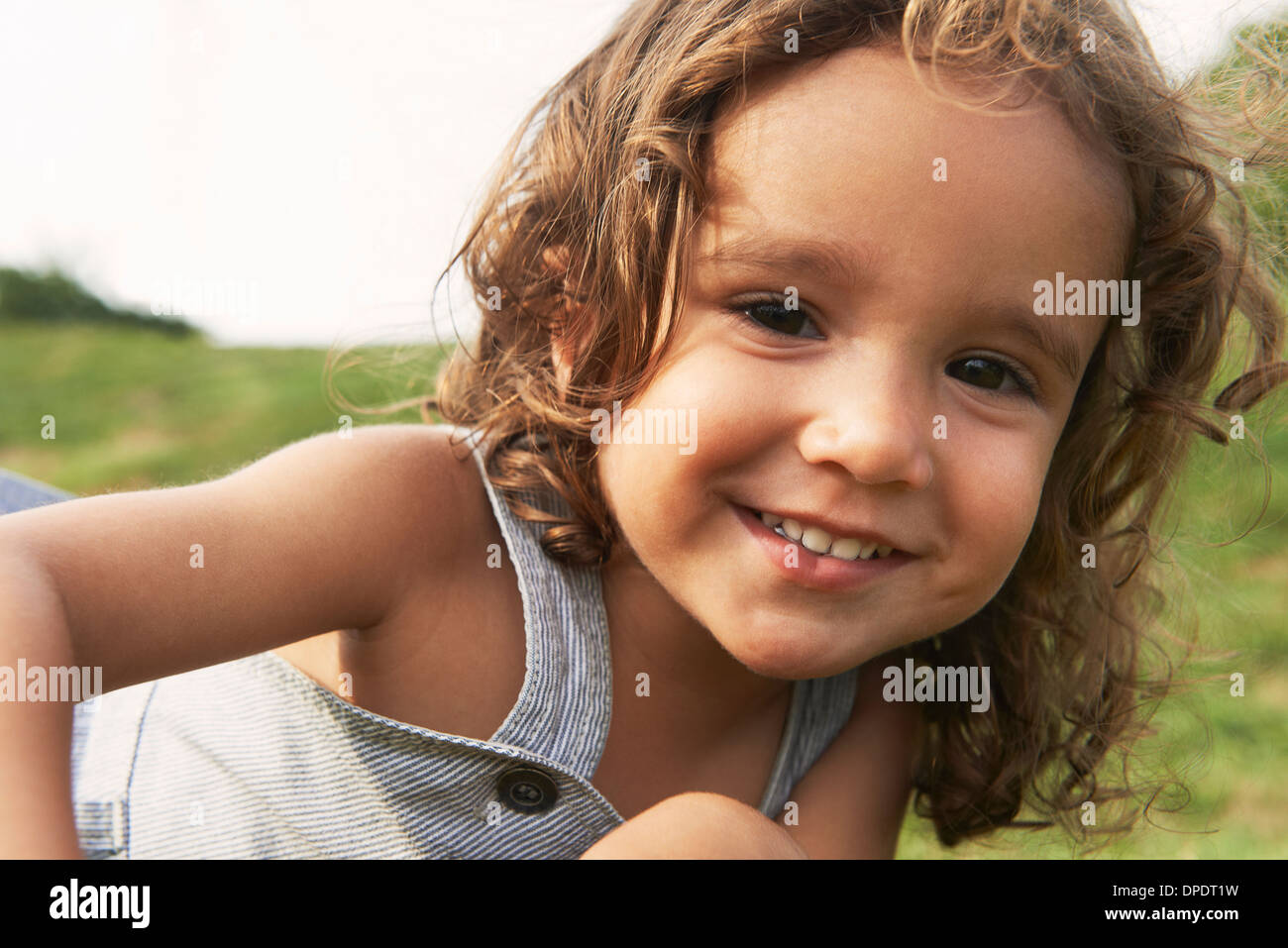 Portrait of young boy with brown hair, smiling Stock Photo