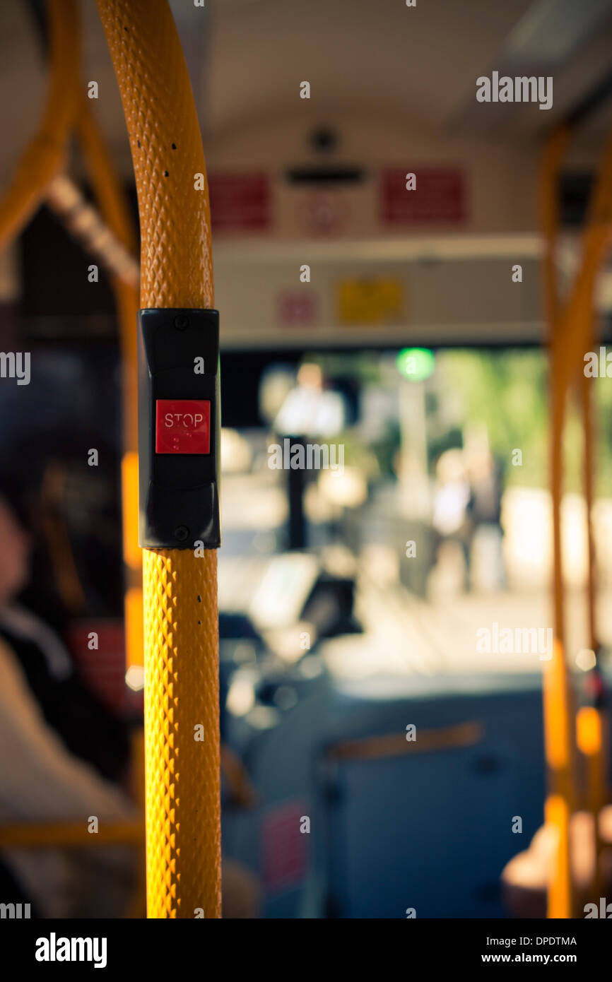 Inside public city bus transport and stop button detail. Stock Photo