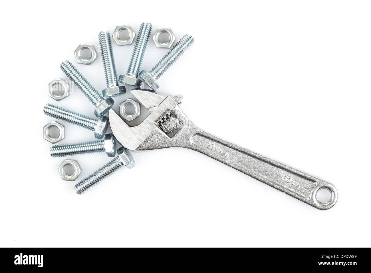 Adjustable wrench with screws and nuts on white background Stock Photo
