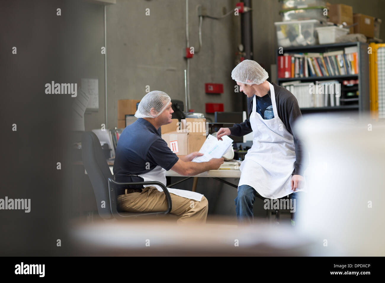 Factory workers in office Stock Photo