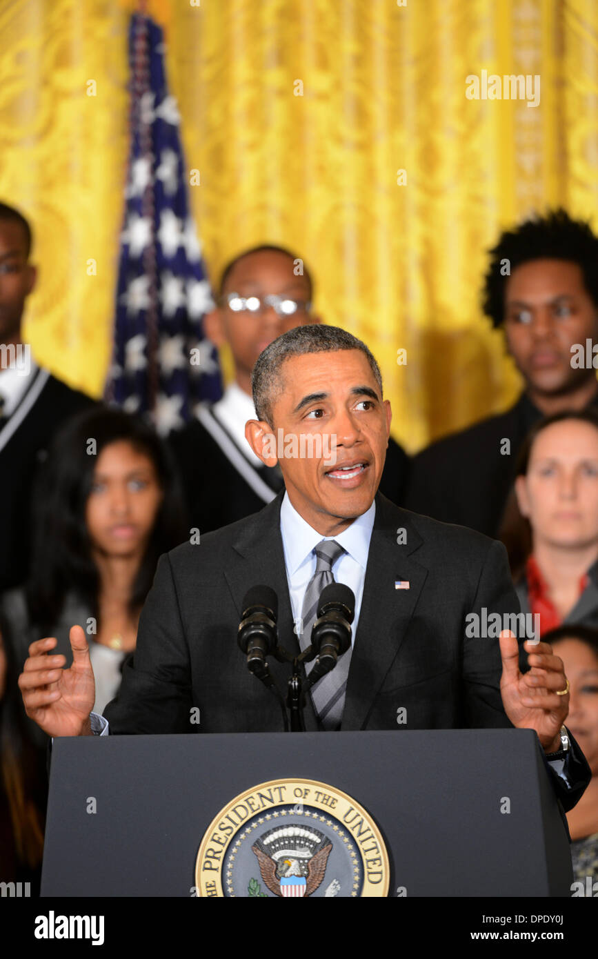 US President Barack Obama announces the first five 'Promise Zones,' located in San Antonio, Philadelphia, Los Angeles, Southeastern Kentucky, and the Choctaw Nation of Oklahoma in the East Room of the White House January 9, 2014 in Washington, DC. Stock Photo