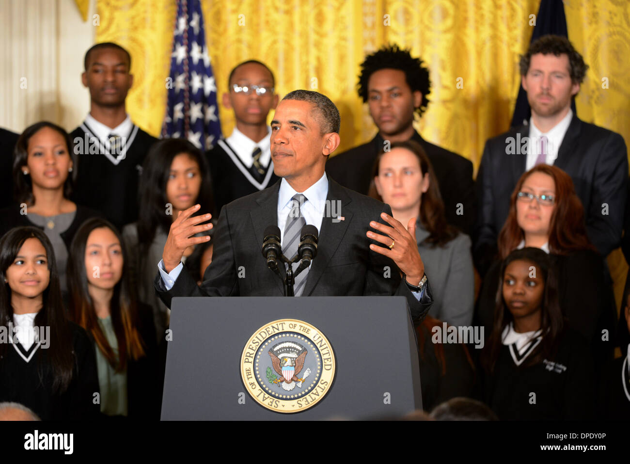 US President Barack Obama announces the first five 'Promise Zones,' located in San Antonio, Philadelphia, Los Angeles, Southeastern Kentucky, and the Choctaw Nation of Oklahoma in the East Room of the White House January 9, 2014 in Washington, DC. Stock Photo