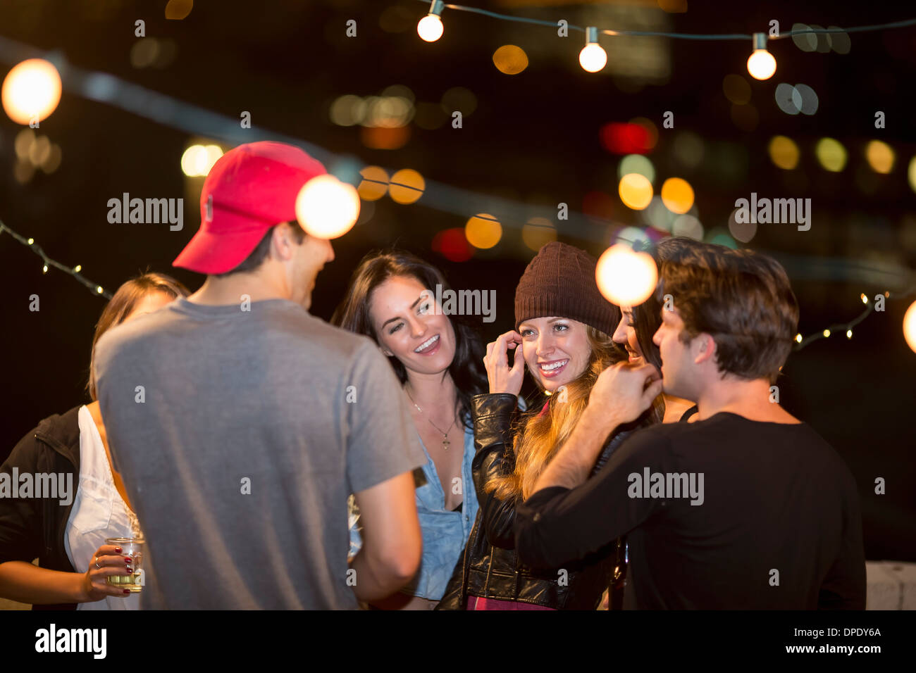 Young adult friends having fun at rooftop party Stock Photo