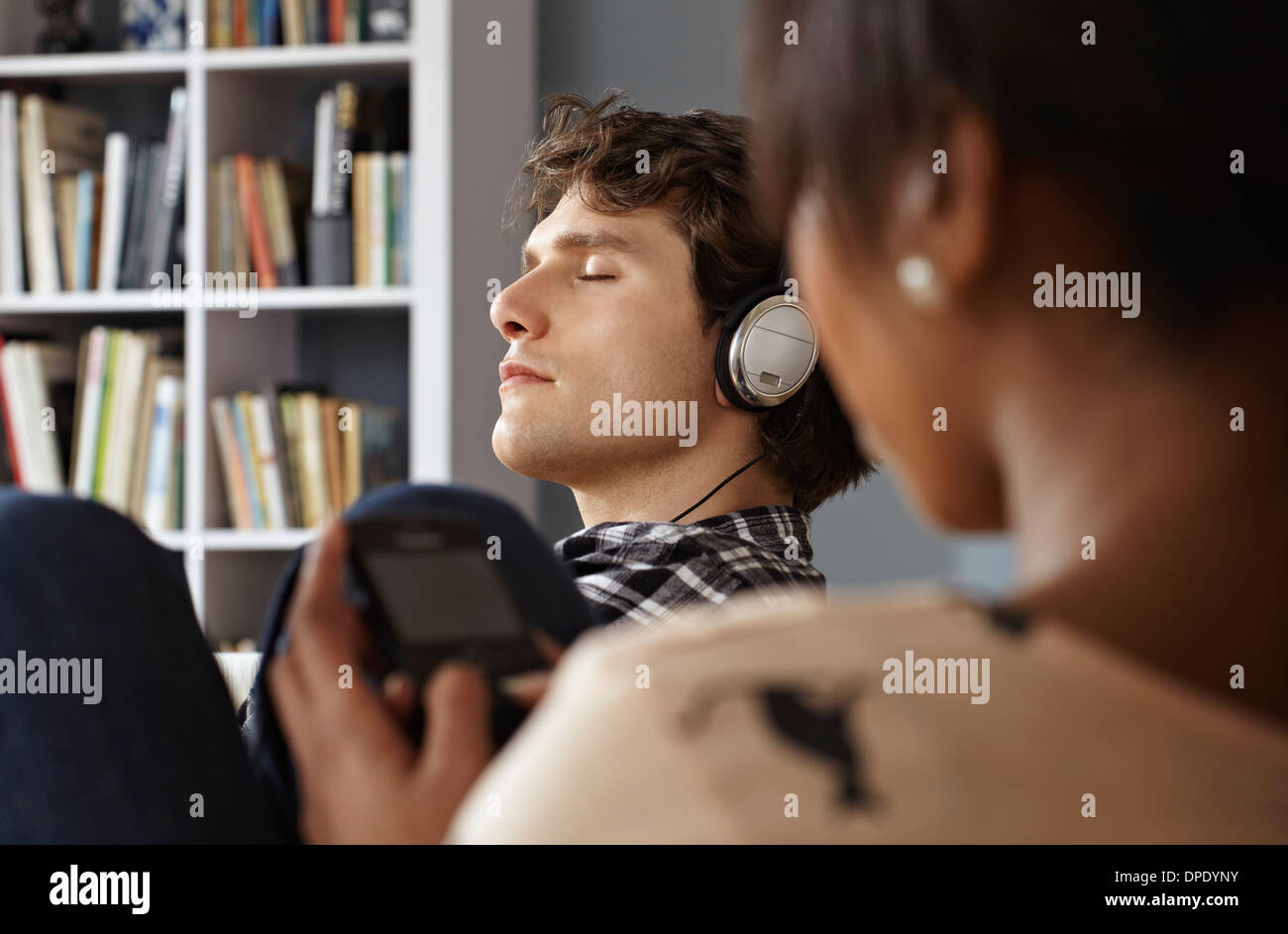 Black couple relaxing on sofa hi-res stock photography and images - Alamy