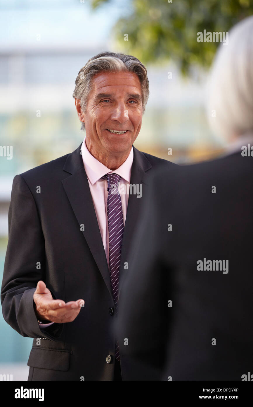 Businesspeople having conversation Stock Photo
